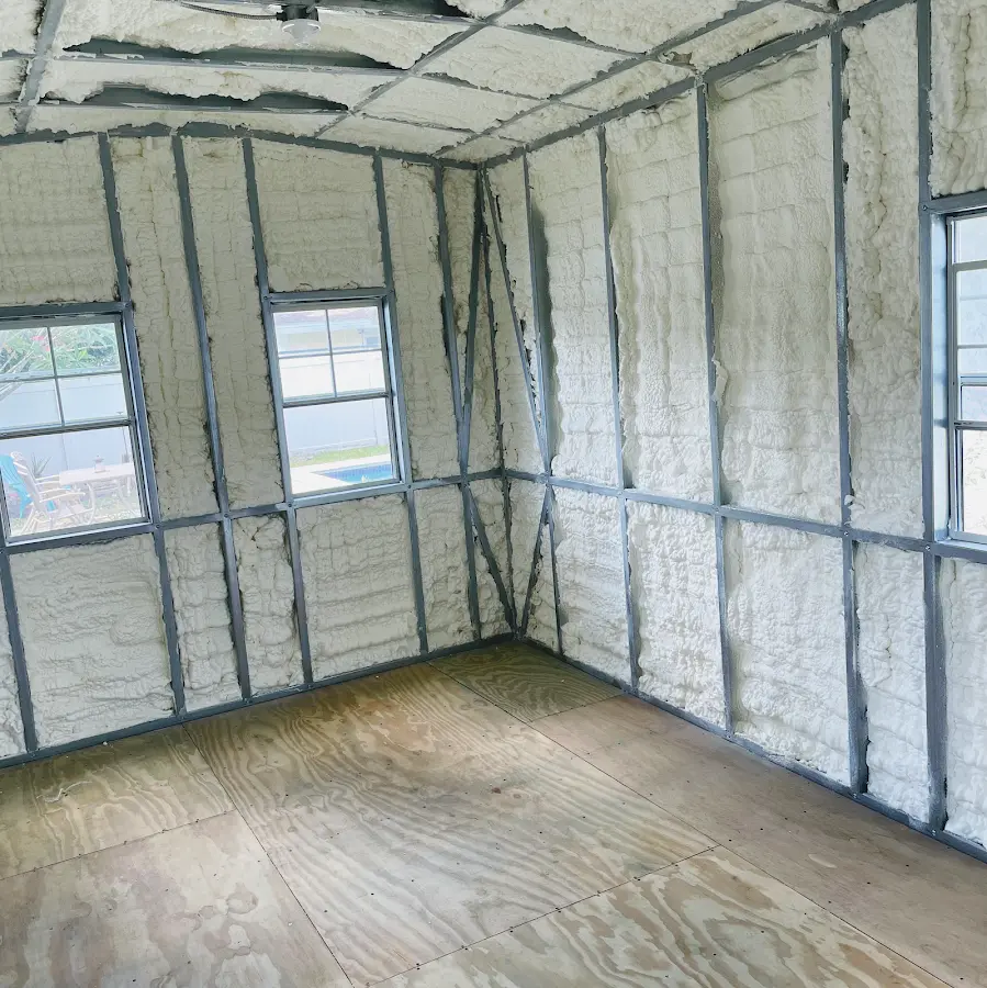 Closed-cell spray foam insulation applied to wall cavities in a residential project in Harvey